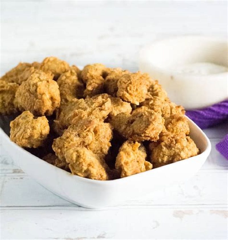 Bowl of crispy buttermilk chicken bites with dipping sauce